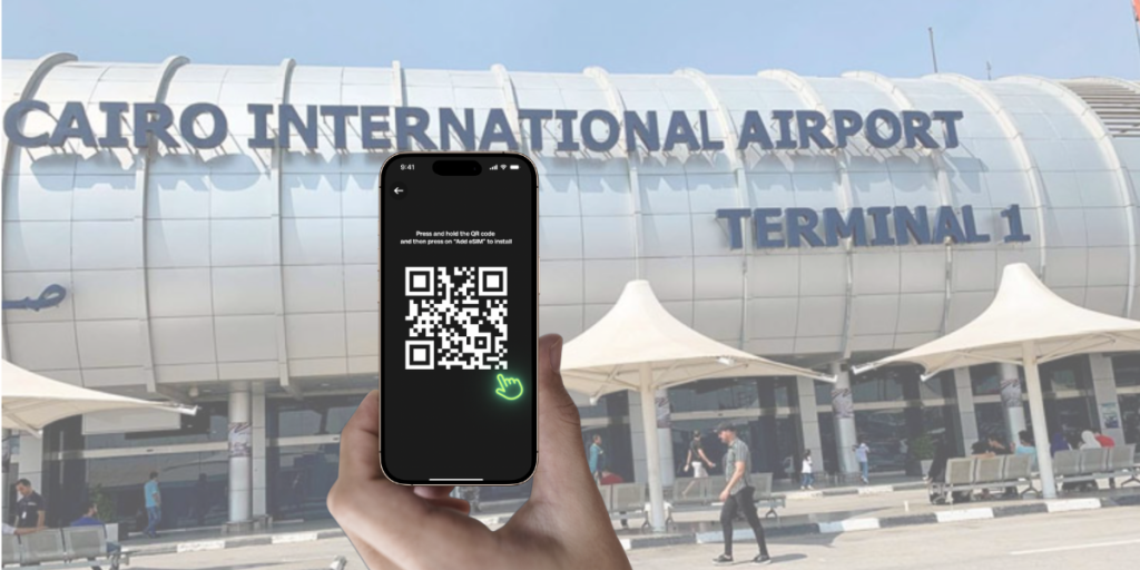 Tourist activating eSIM via QR code outside Cairo International Airport