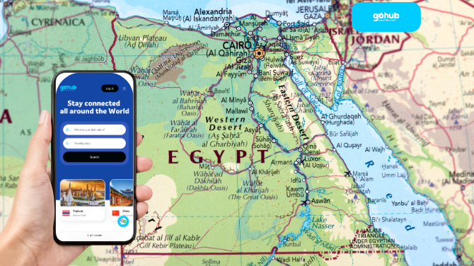 Phone showing Gohub eSIM interface on top of Egypt travel map background