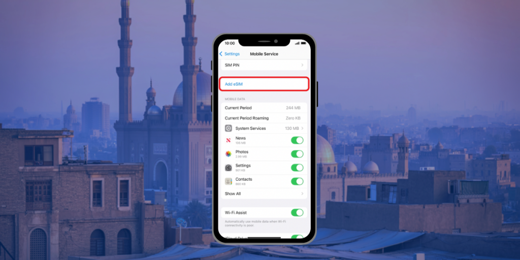 Phone showing eSIM setup screen with Cairo skyline and mosque in the background